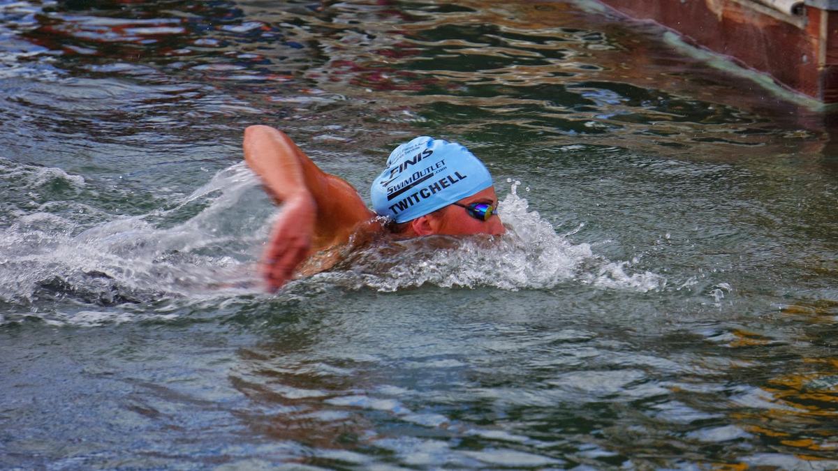 Open water swimmer sighting forward mid-stroke